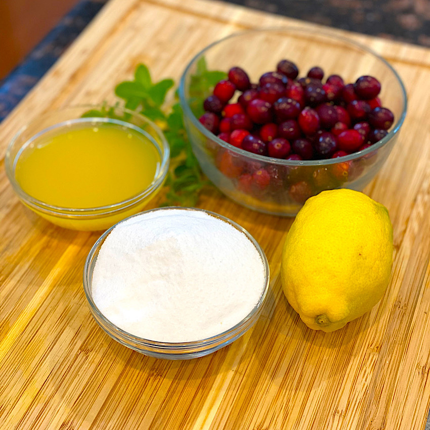 The cranberry chutney is made from simple ingredients like orange juice, sugar, and fresh cranberries. They are pictured here.