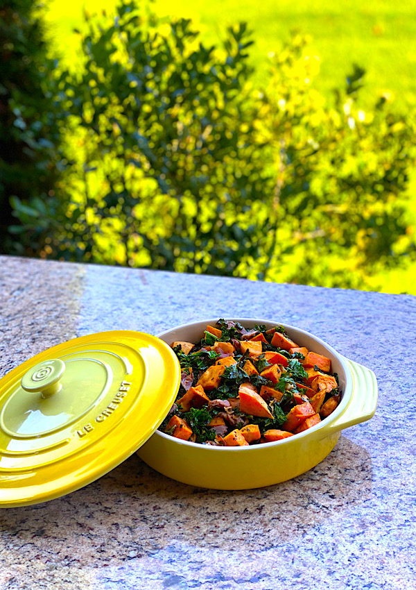 serving dish of sweet potatoes and kale