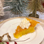 Slice of Buttermilk Pie with Whiskey Whipped Cream