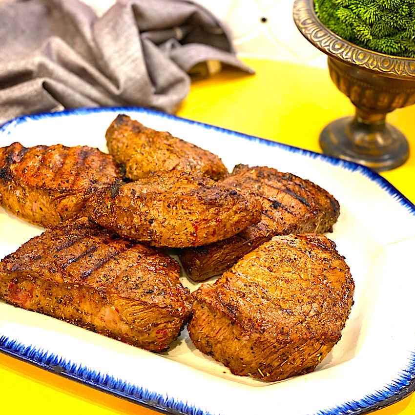 Grilled steak on a large platter
